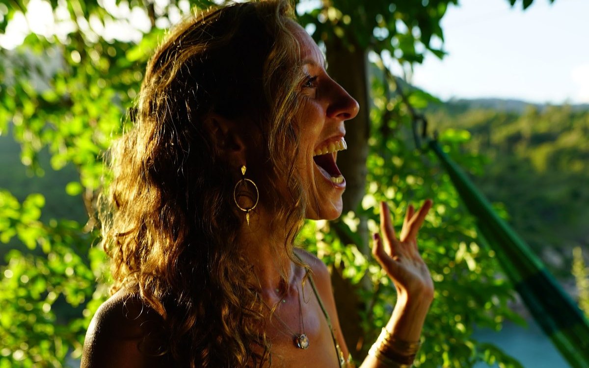 Francie La Flow singing in golden light in Bali
