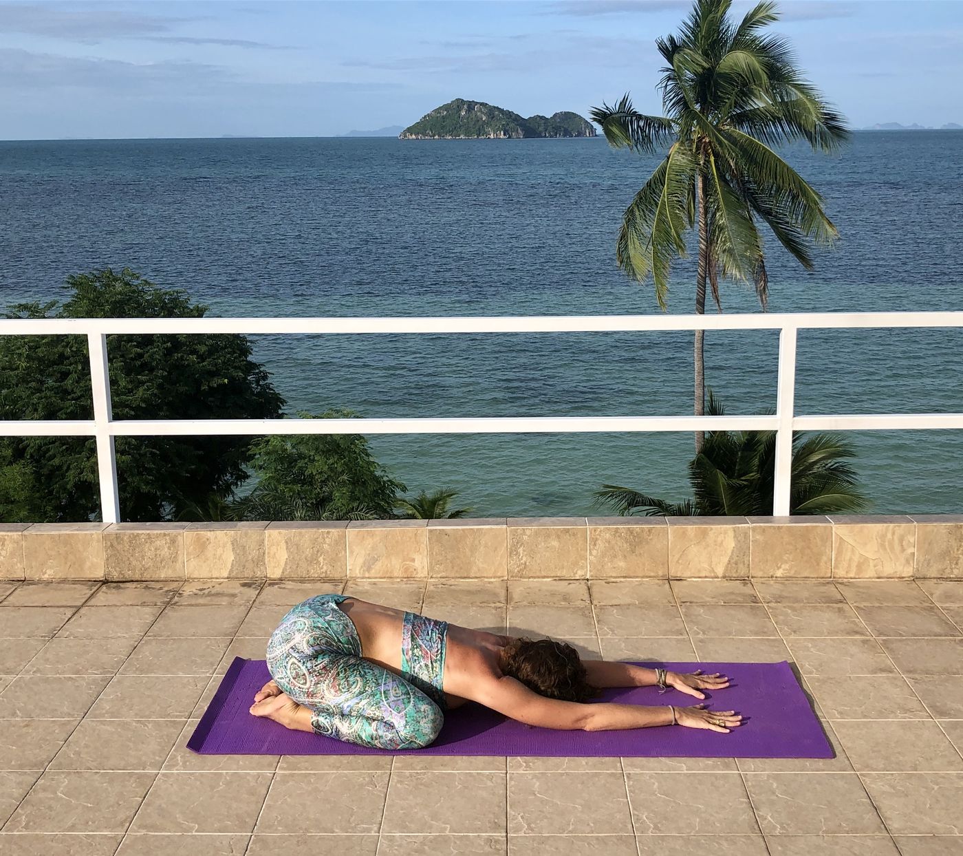 Francie in child's pose with arms stretched forward