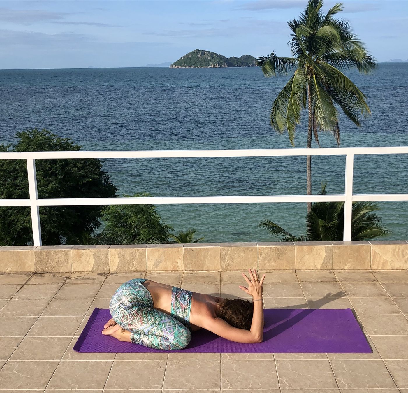 Child's pose with elbows rooted and hands in prayer